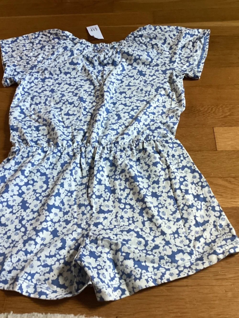 A blue and white floral Gap Kids romper size 6-7